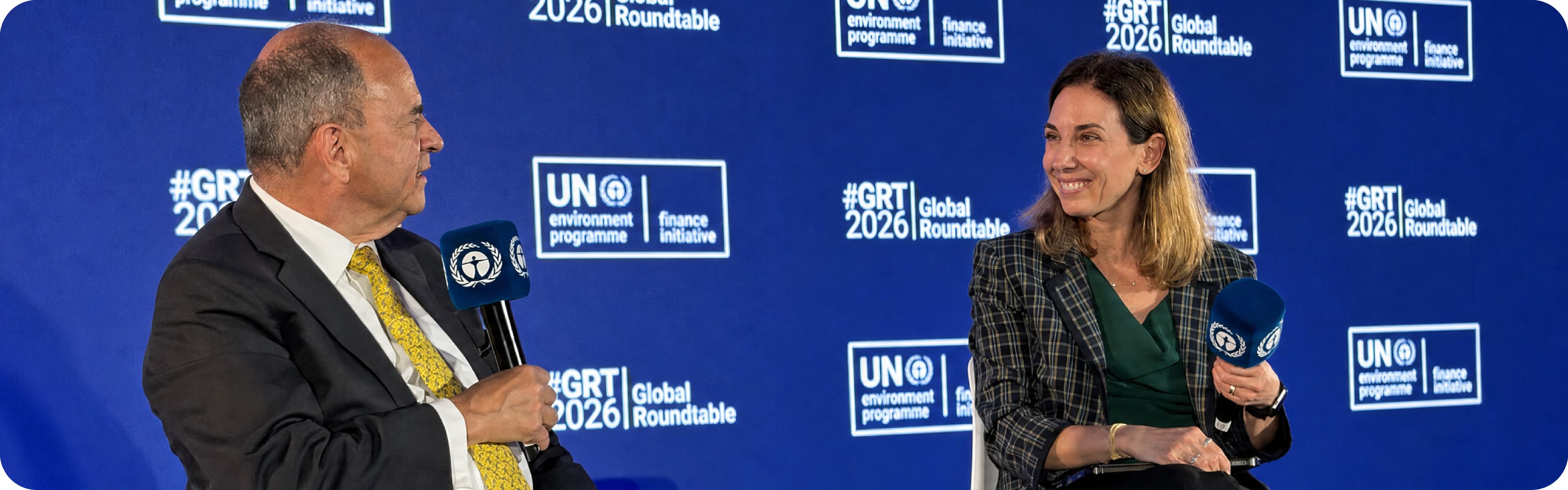 Henry Fernandez and Maria Sosa Taborda speak on stage at the UNEP FI Global Roundtable 2026 in London.
